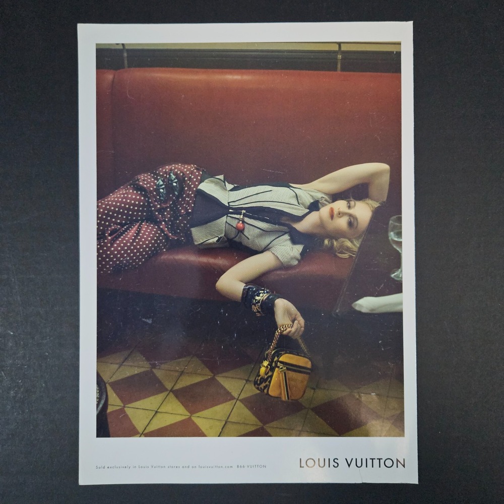 2009 Louis Vuitton‎ Lady With Purse Handbag Laying On Restaurant Bench Print Ad